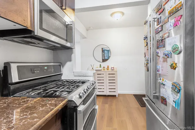 a kitchen with appliances cabinets and a stove
