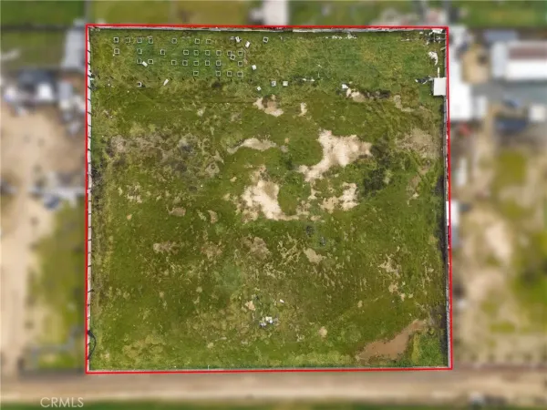 a view of a lake with houses in the back
