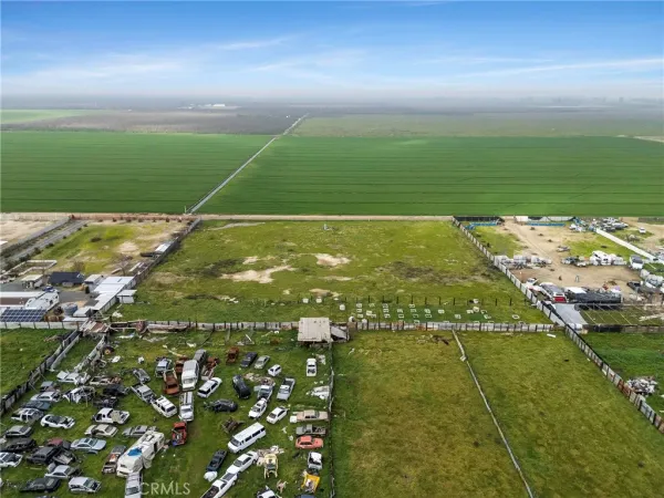 a view of a swimming pool and an outdoor seating