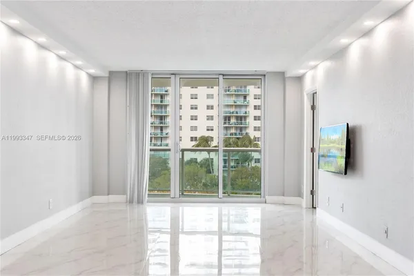 a view of an empty room with a window