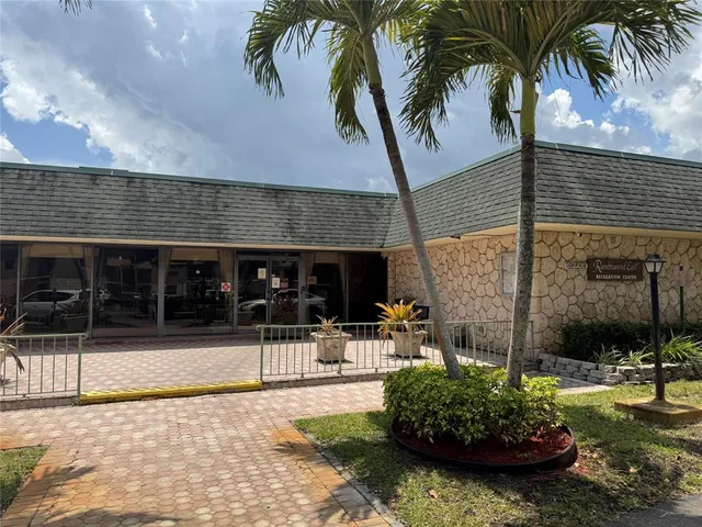 a view of a backyard patio and swimming pool