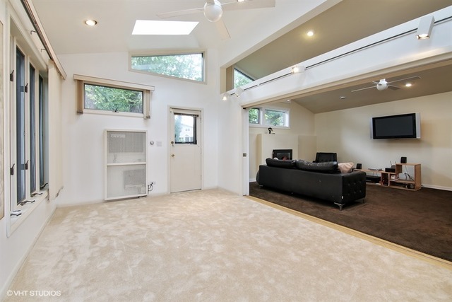 1190 Ridge Road Highland Park, IL 60035 - Photo 13 of 13 a living room with furniture and a flat screen tv