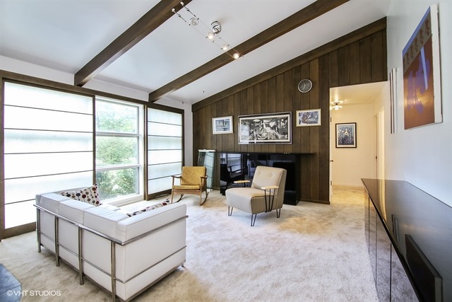 1190 Ridge Road Highland Park, IL 60035 - Photo 3 of 13 a living room with couches bookshelf and a large window
