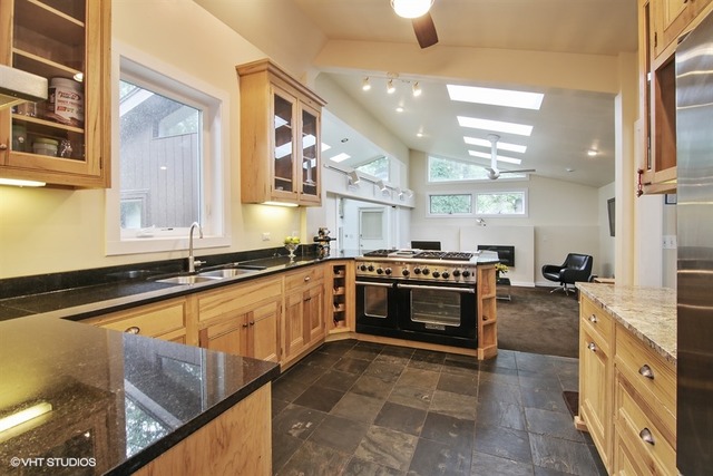 1190 Ridge Road Highland Park, IL 60035 - Photo 6 of 13 a large kitchen with stainless steel appliances granite countertop a stove and a sink