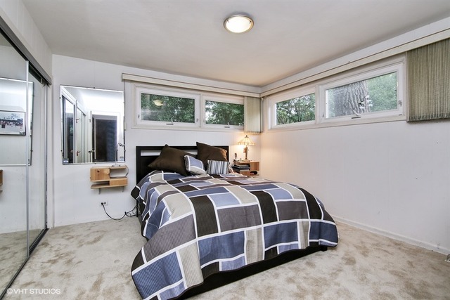 1190 Ridge Road Highland Park, IL 60035 - Photo 7 of 13 a bedroom with a large bed and a window