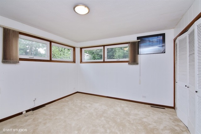 1190 Ridge Road Highland Park, IL 60035 - Photo 10 of 13 an empty room with windows and closet