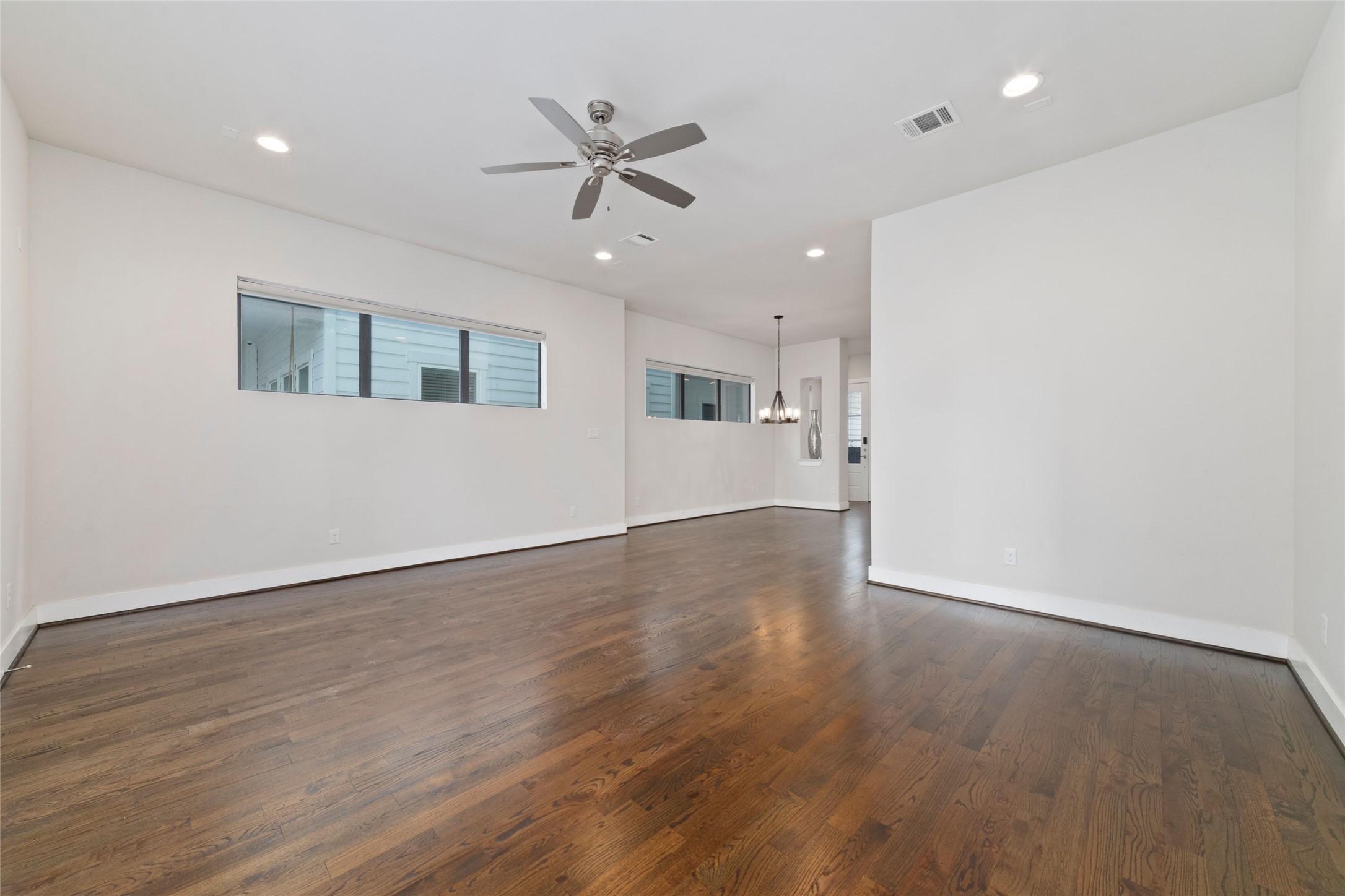 1917 West 15th Street, Unit A Houston, TX 77008 - Photo 16 of 34 wooden floor in an empty room with a window