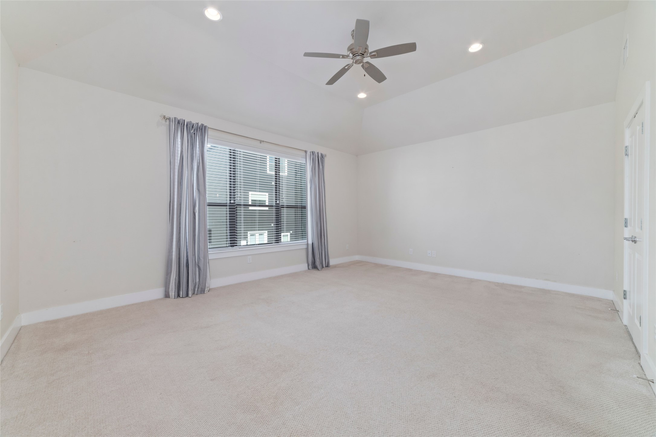 1917 West 15th Street, Unit A Houston, TX 77008 - Photo 17 of 34 an empty room with windows and fan