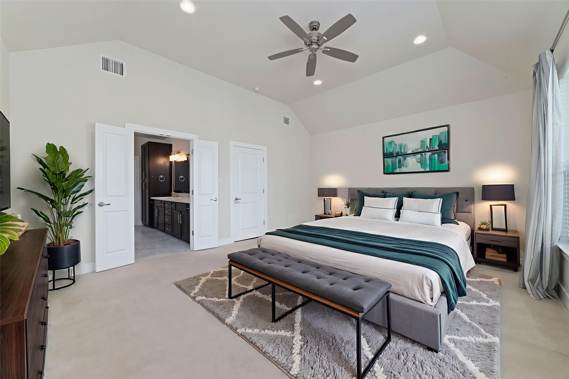 1917 West 15th Street, Unit A Houston, TX 77008 - Photo 19 of 34 a bedroom with a bed and a potted plant