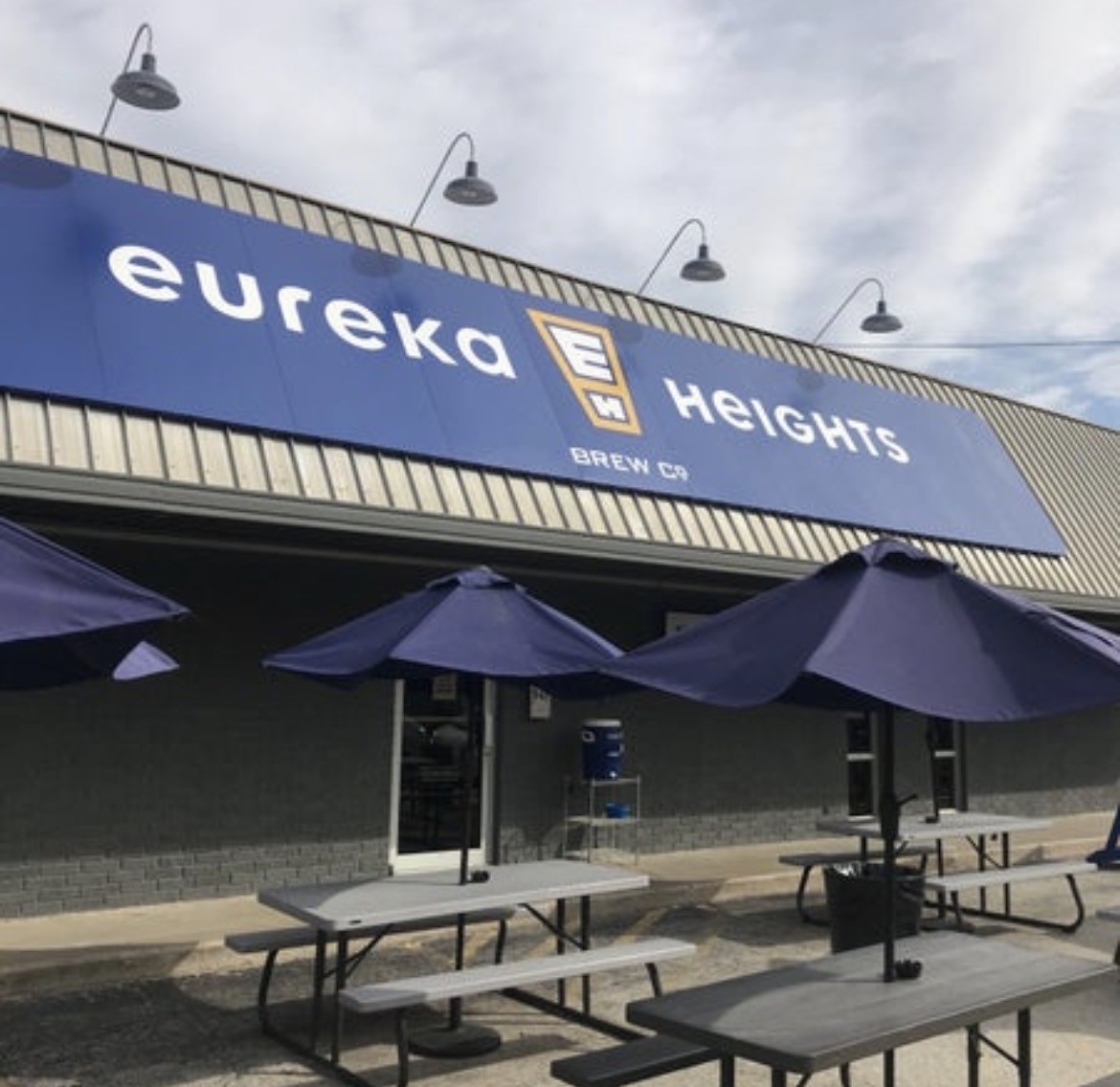 1917 West 15th Street, Unit A Houston, TX 77008 - Photo 32 of 34 a front view of a building with table and chairs