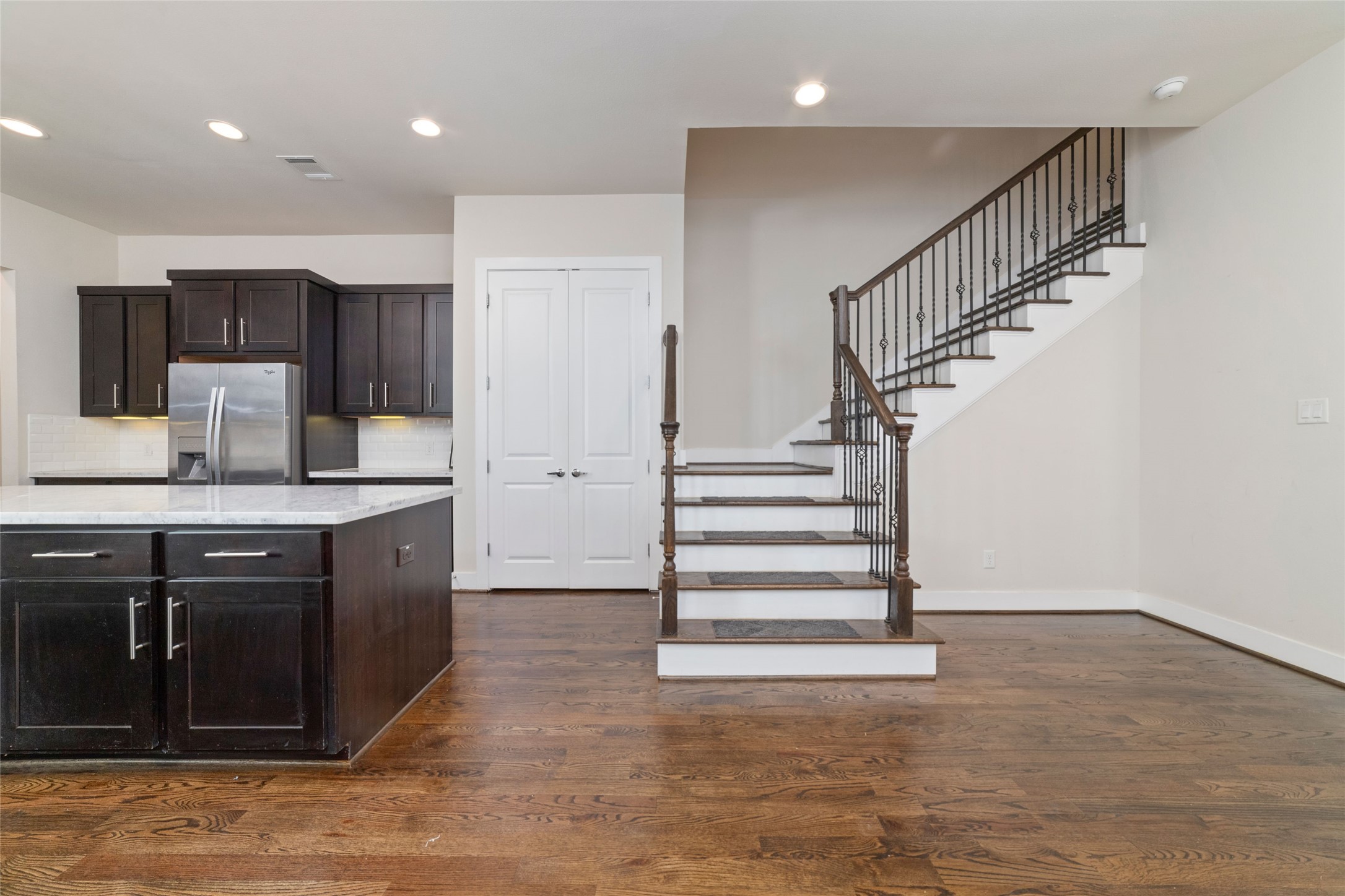 1917 West 15th Street, Unit A Houston, TX 77008 - Photo 4 of 34 a kitchen with stainless steel appliances granite countertop a sink stove and cabinets