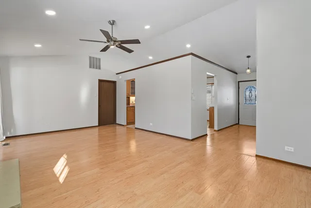 a view of a dining room with furniture large windows and wooden floor