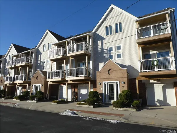 a front view of residential houses with street