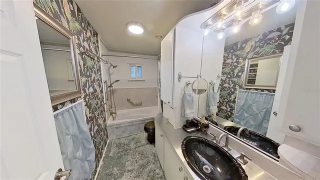 a view of an empty room with window and furniture