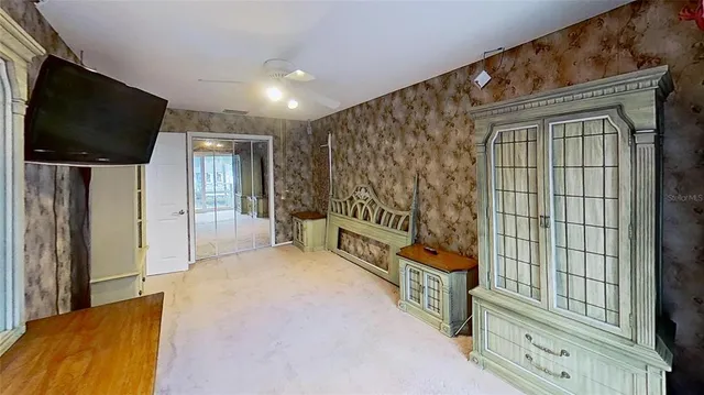 a view of front door and bedroom