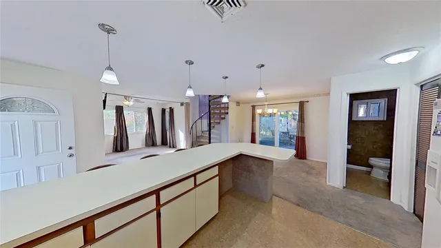 a hallway with mirror and window