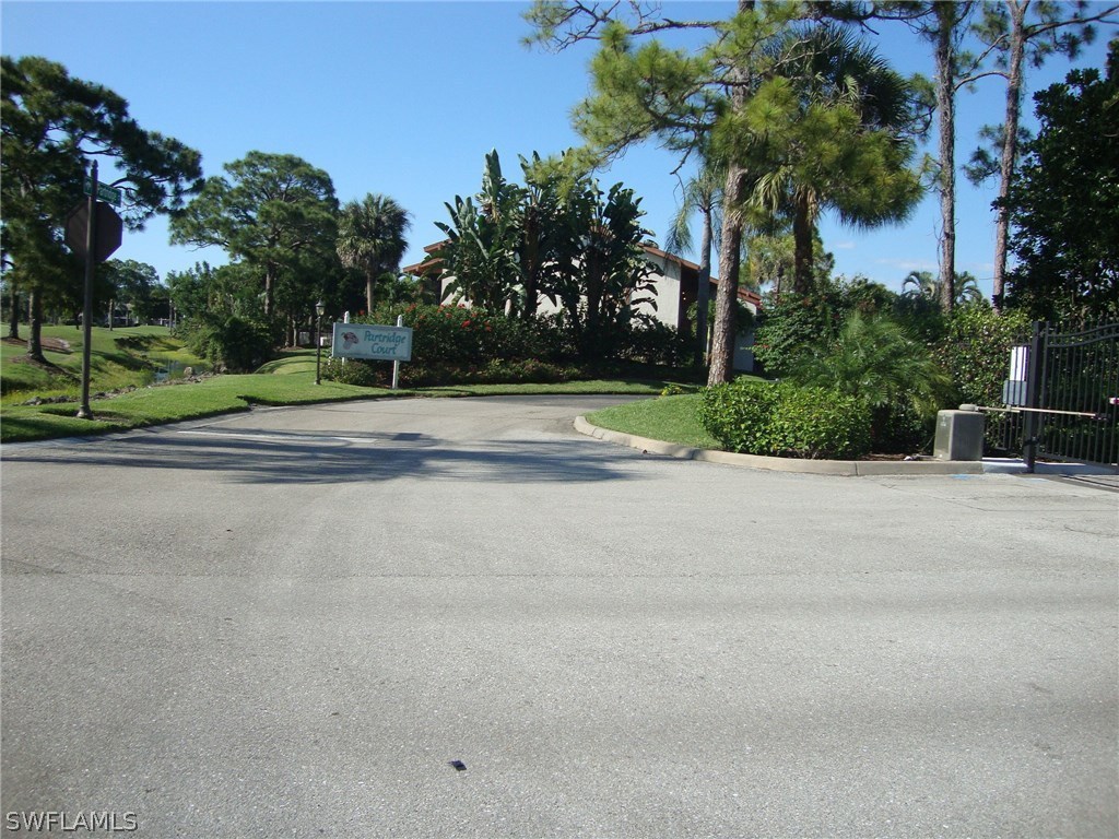 16540 Partridge Club Road, Unit 203 Fort Myers, FL 33908 - Photo 6 of 25 a view of a yard