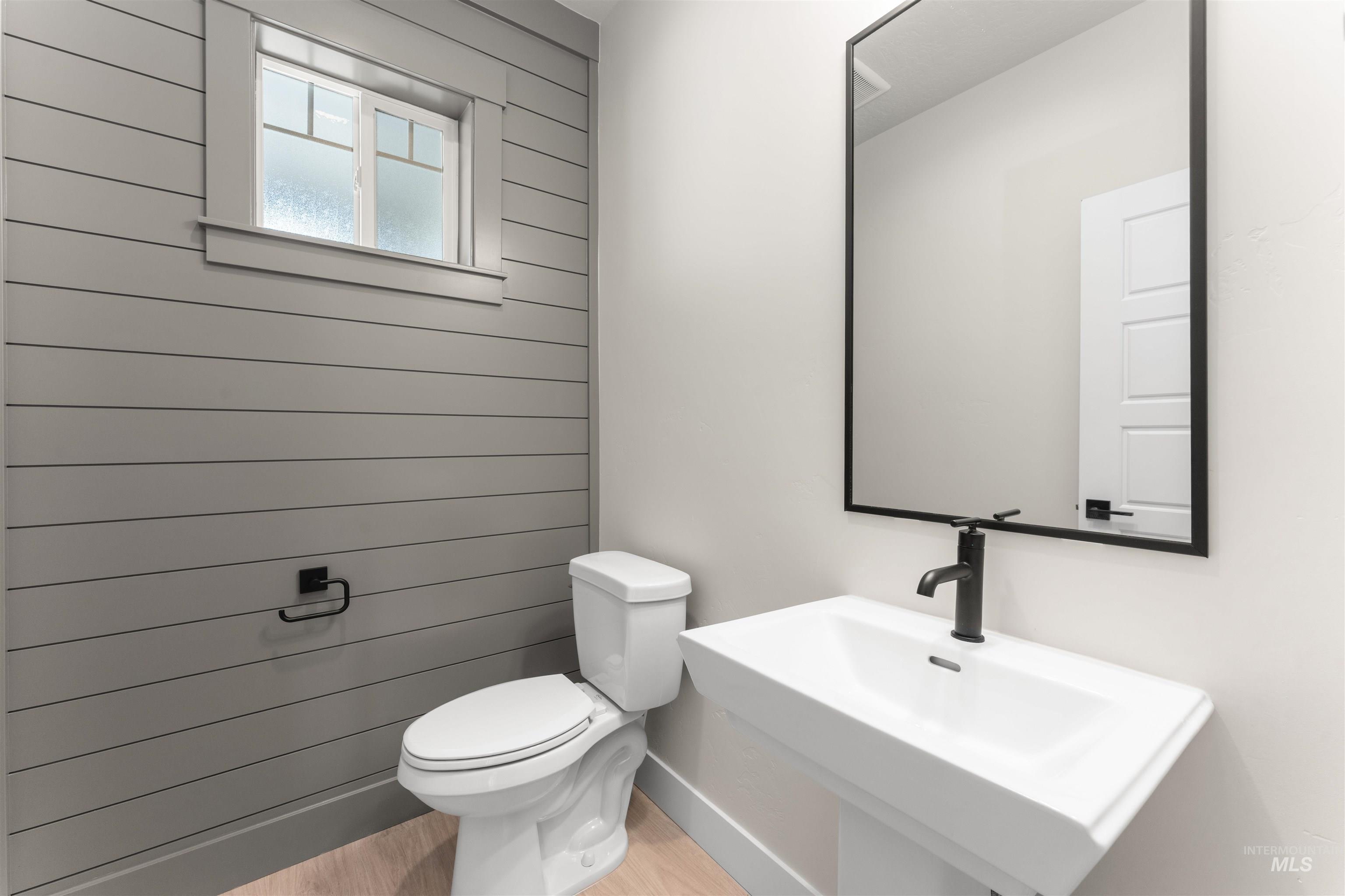 8076 Tandy Cv Street Middleton, ID 83644 - Photo 16 of 41 Bathroom with toilet and light wood-style flooring
