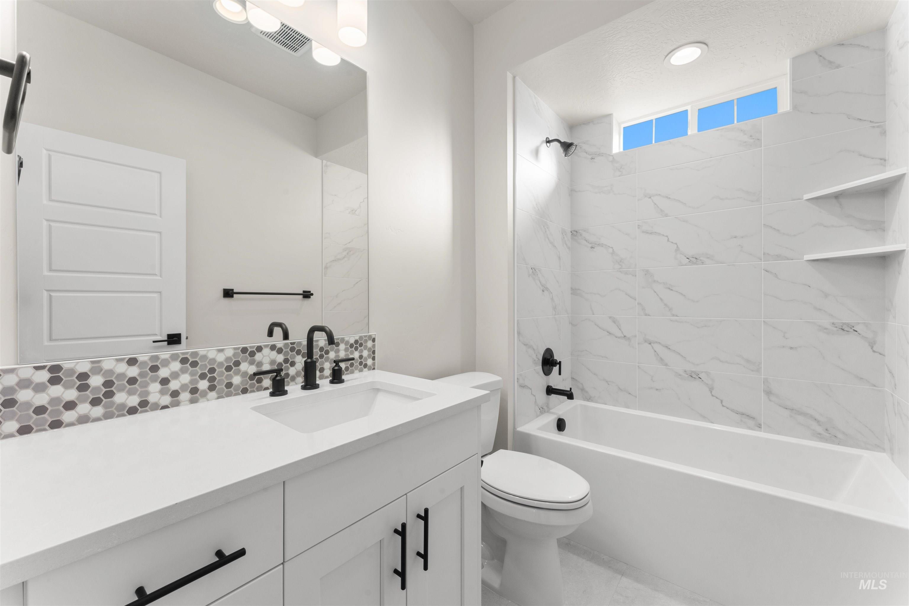 8076 Tandy Cv Street Middleton, ID 83644 - Photo 28 of 41 Full bathroom featuring vanity and bathing tub / shower combination