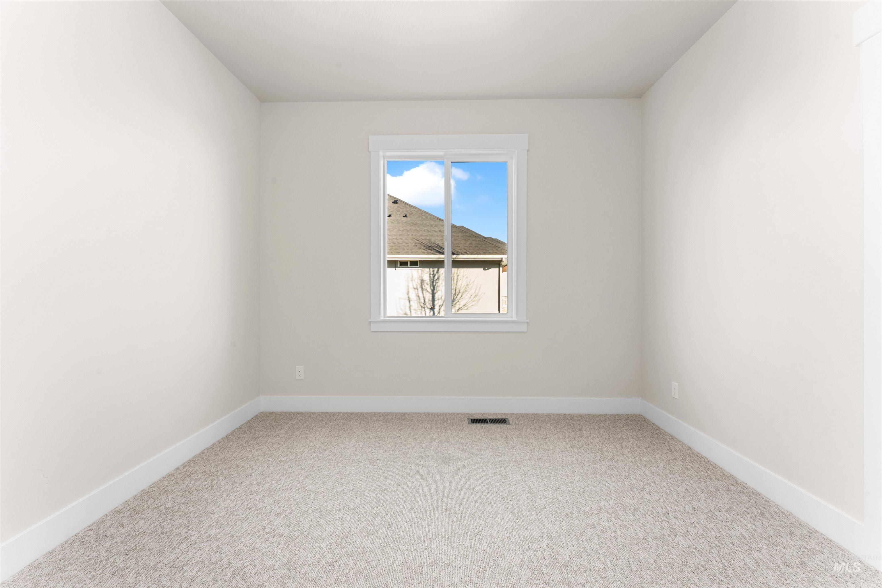 8076 Tandy Cv Street Middleton, ID 83644 - Photo 29 of 41 Empty room with light colored carpet and baseboards