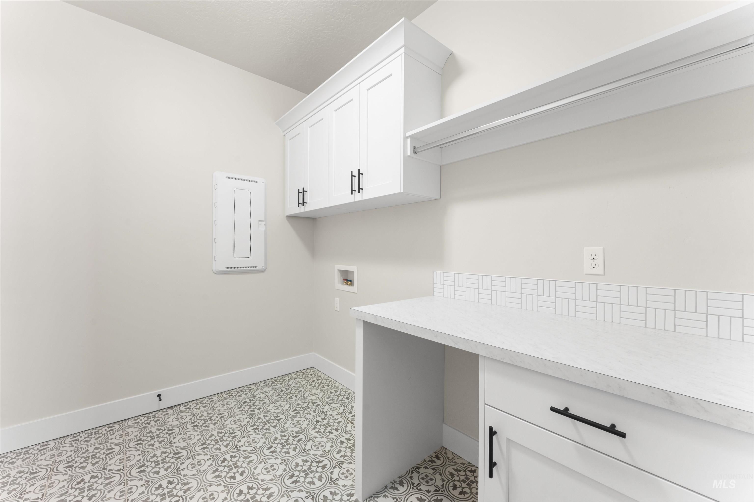 8076 Tandy Cv Street Middleton, ID 83644 - Photo 33 of 41 Laundry room with washer hookup, electric panel, and cabinet space