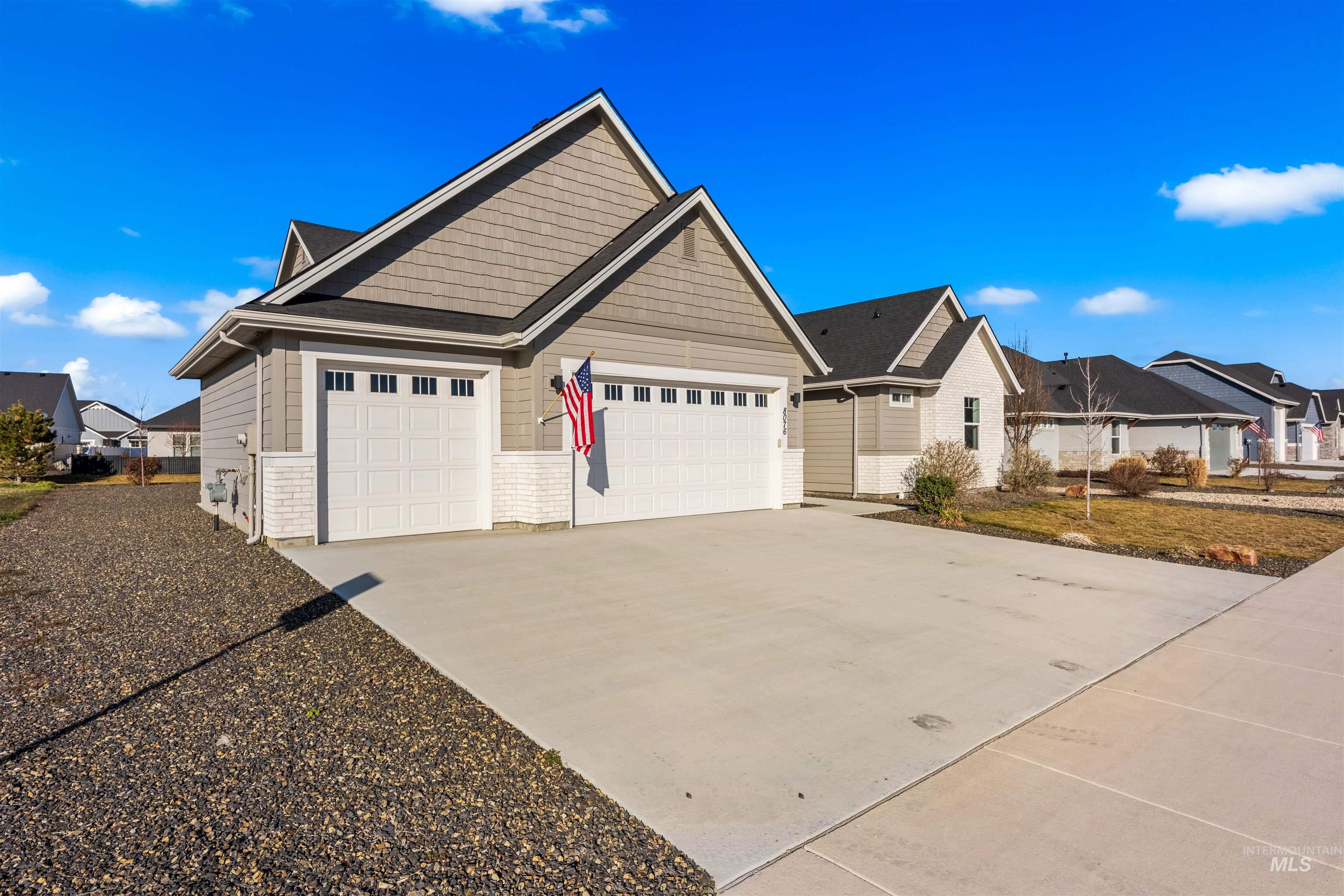 8076 Tandy Cv Street Middleton, ID 83644 - Photo 39 of 41 View of front of home featuring concrete driveway, a residential view, and a garage