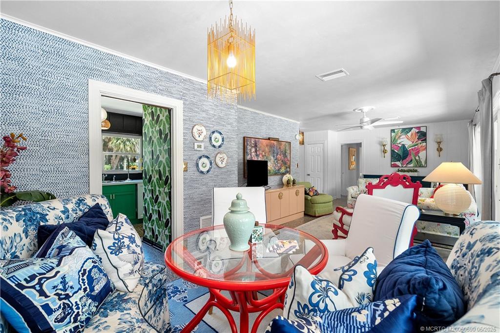 109 North Sewalls Point Road Stuart, FL 34996 - Photo 11 of 33 a living room with furniture and a chandelier