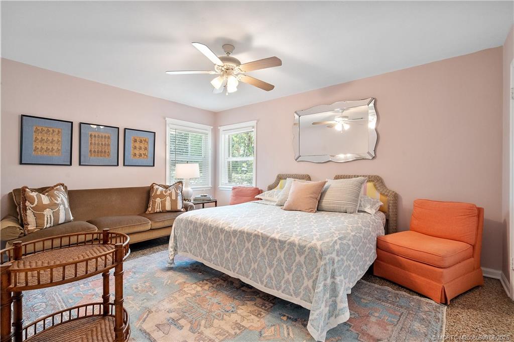 109 North Sewalls Point Road Stuart, FL 34996 - Photo 13 of 33 a bedroom with a bed and couch