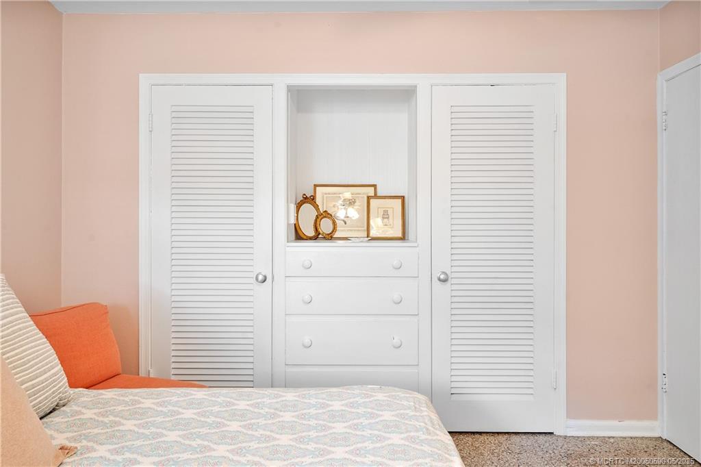 109 North Sewalls Point Road Stuart, FL 34996 - Photo 14 of 33 a bedroom with a bed and a window