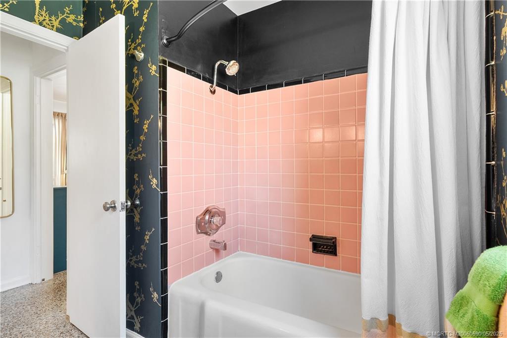 109 North Sewalls Point Road Stuart, FL 34996 - Photo 16 of 33 a bathroom with a bathtub and shower