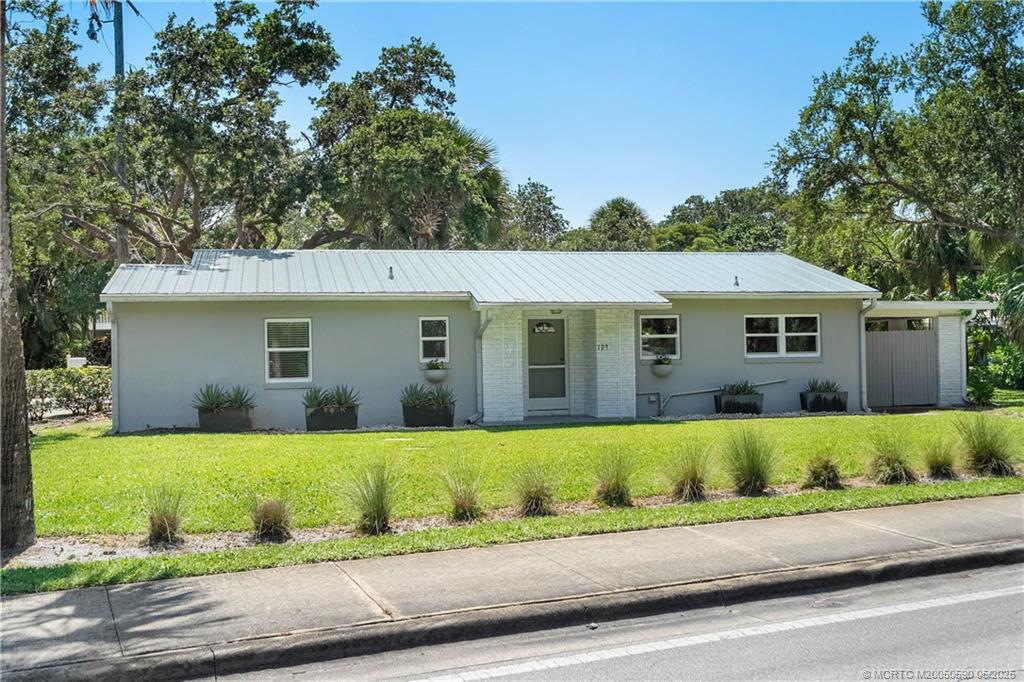 109 North Sewalls Point Road Stuart, FL 34996 - Photo 22 of 33 front view of a house with a yard