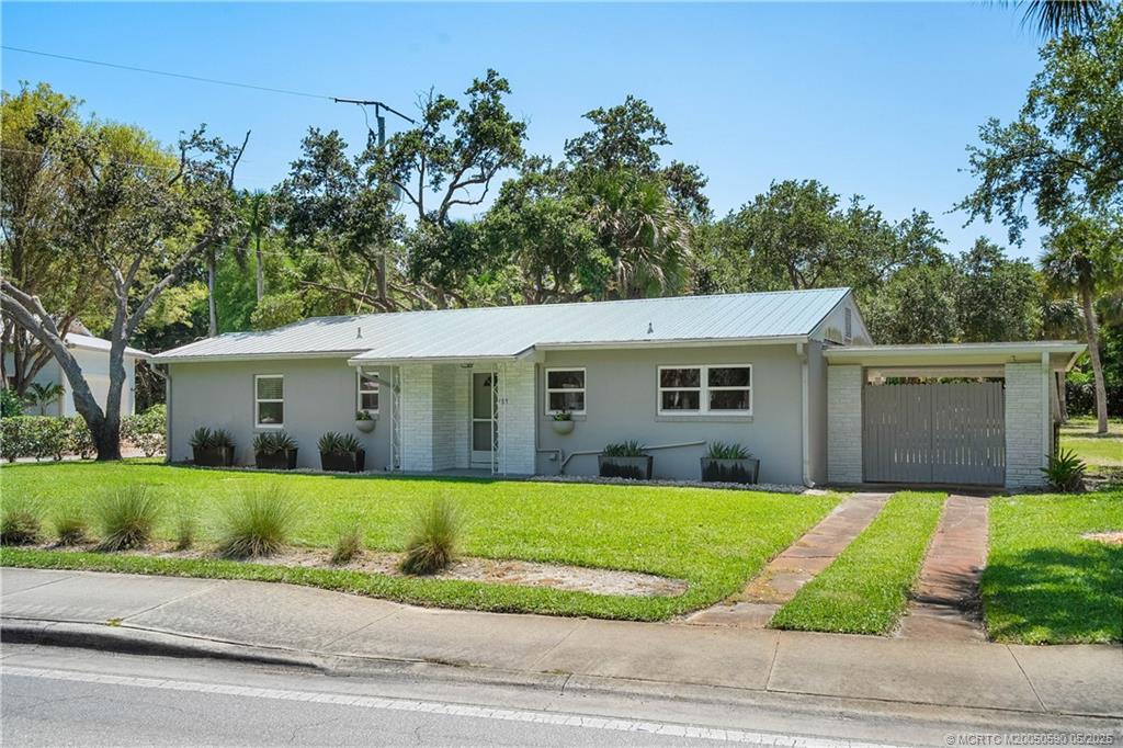 109 North Sewalls Point Road Stuart, FL 34996 - Photo 24 of 33 a view of a house with a yard