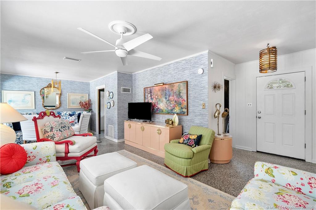 109 North Sewalls Point Road Stuart, FL 34996 - Photo 9 of 33 a living room with furniture and a flat screen tv