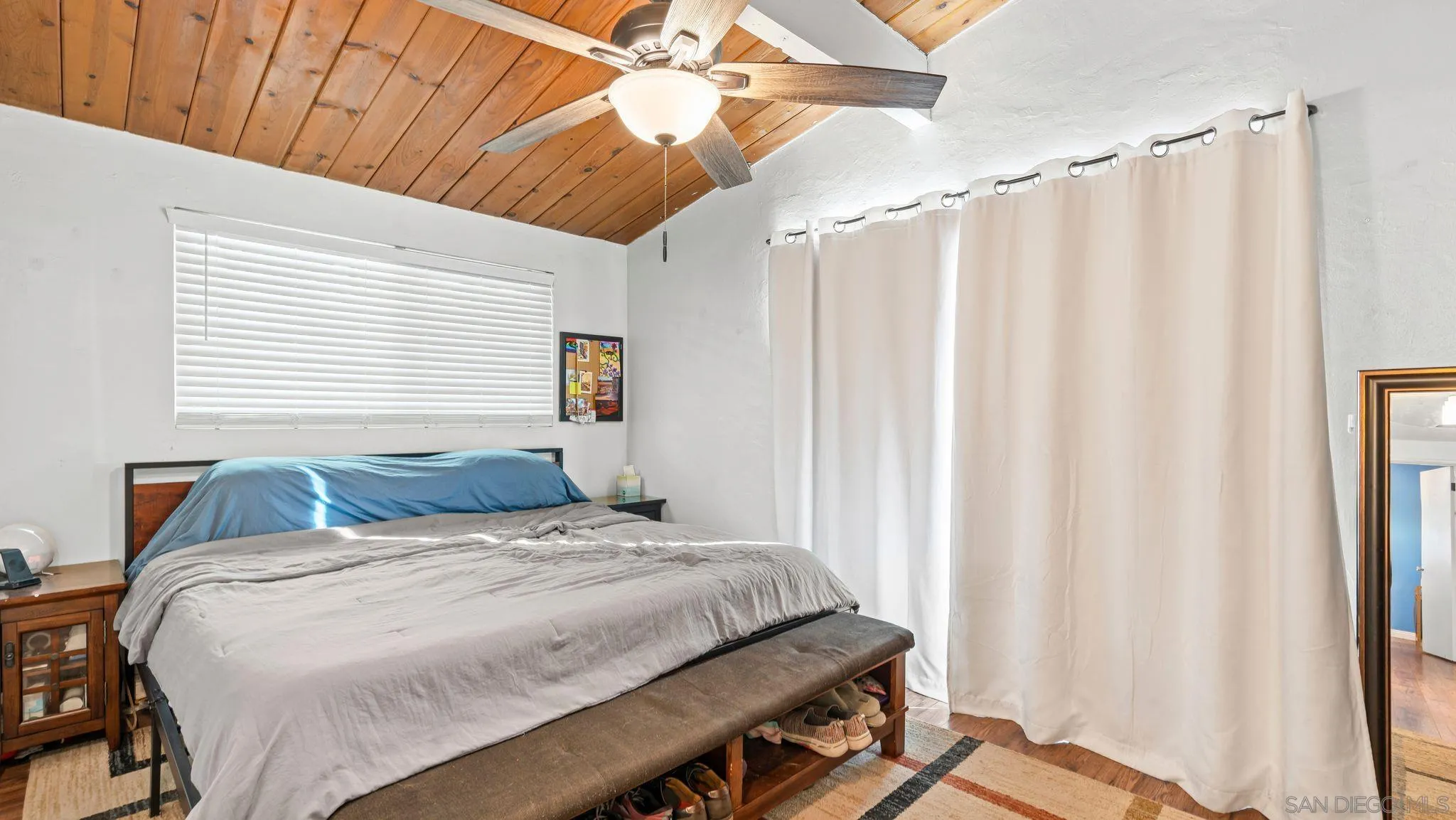 9144 Fanita Rancho Road Santee, CA 92071 - Photo 14 of 28 a bedroom with a bed and a window