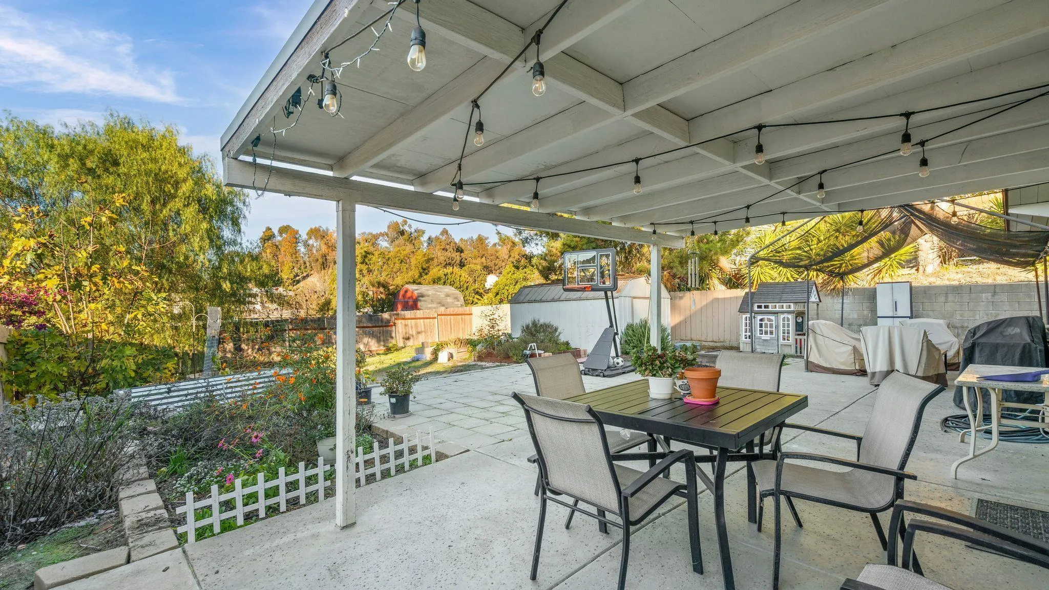 9144 Fanita Rancho Road Santee, CA 92071 - Photo 24 of 28 a view of patio with table and chairs and potted plants
