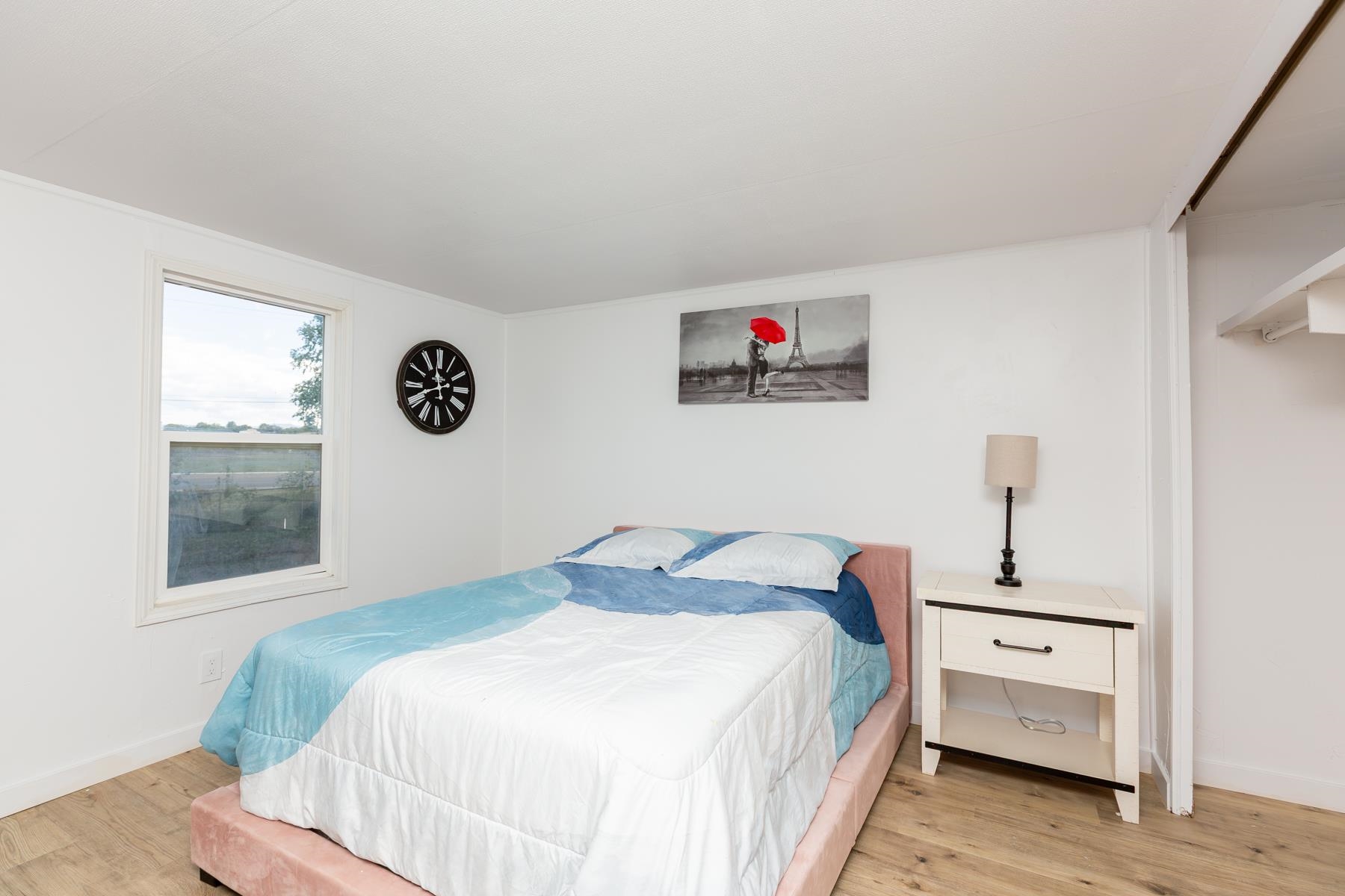 424 32 Road, Unit 112 Clifton, CO 81520 - Photo 26 of 41 a bedroom with a bed and a chandelier