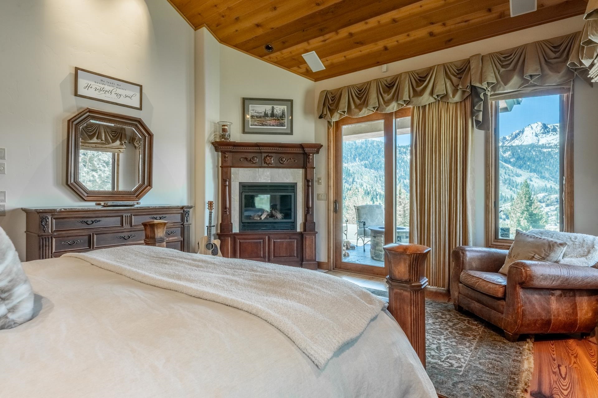 45 Skyline Road June Lake, CA 93529 - Photo 24 of 58 a bedroom with furniture and a fireplace