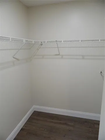 a bathroom with a sink and mirror with toilet