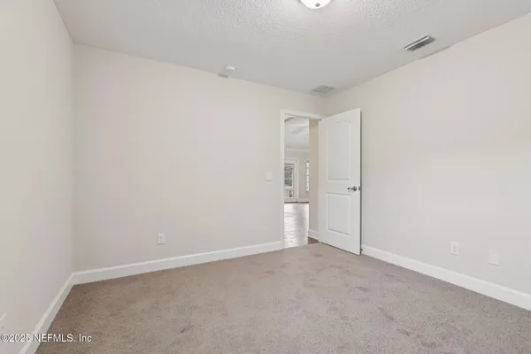 an empty room with a empty space and a window