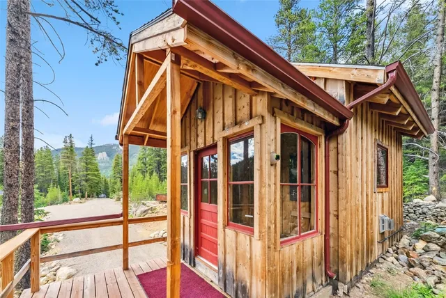 a view of balcony with wooden floor and fence