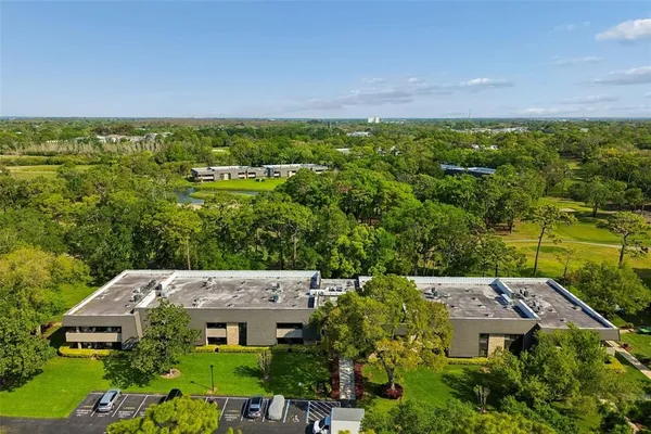 an aerial view of a house with a garden