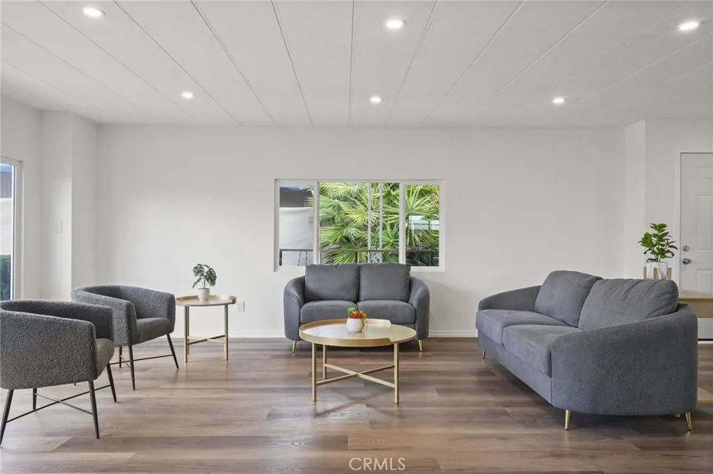 3033 E Valley, Unit 89 West Covina, CA 91792 - Photo 11 of 55 a living room with furniture and a potted plant