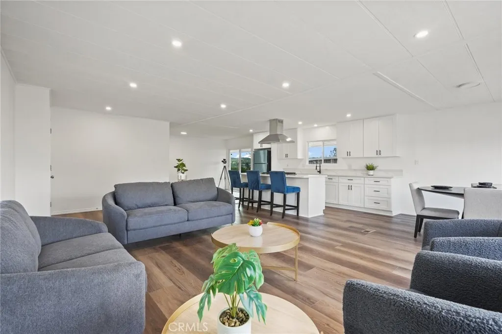 3033 E Valley, Unit 89 West Covina, CA 91792 - Photo 12 of 55 a living room with furniture and kitchen view