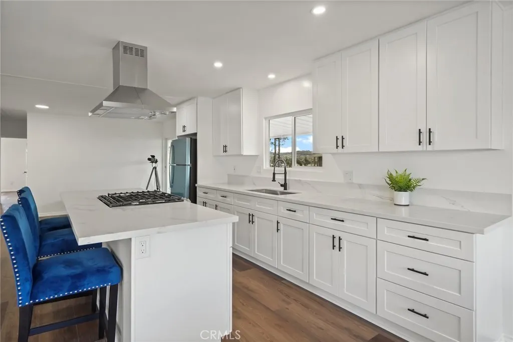 3033 E Valley, Unit 89 West Covina, CA 91792 - Photo 18 of 55 a kitchen with white cabinets and stove