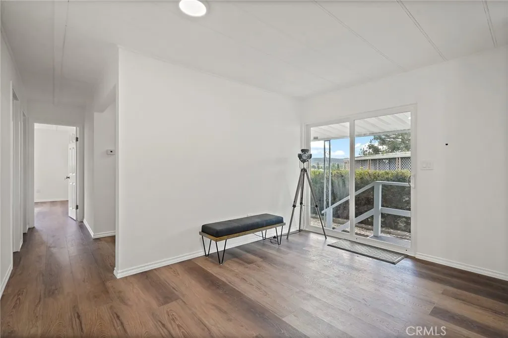 3033 E Valley, Unit 89 West Covina, CA 91792 - Photo 20 of 55 wooden floor in an empty room with a window