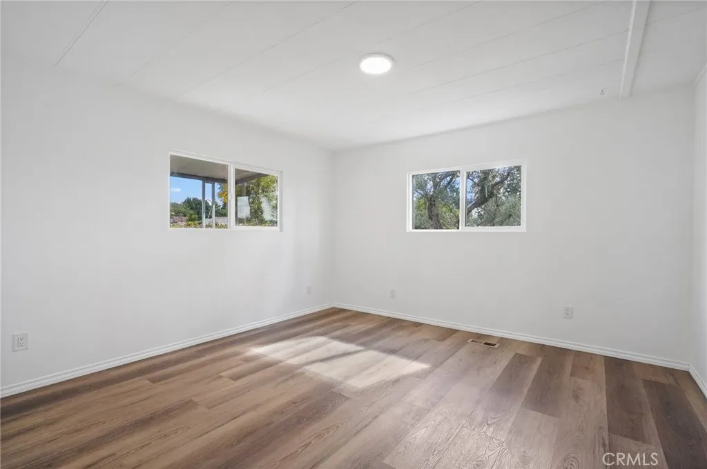 3033 E Valley, Unit 89 West Covina, CA 91792 - Photo 22 of 55 a view of empty room with wooden floor