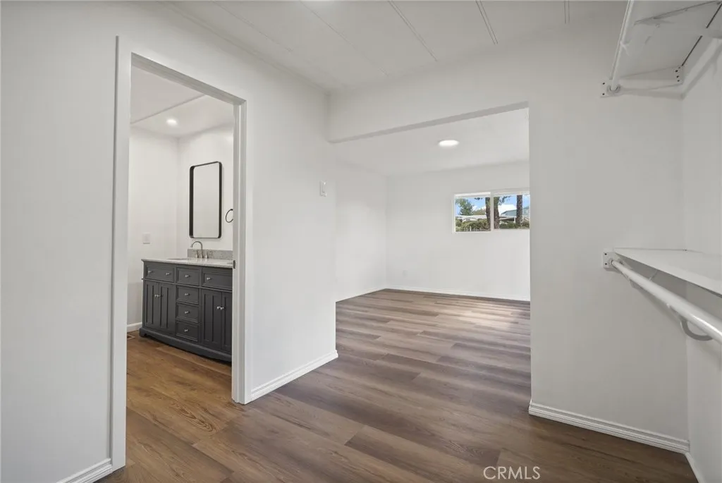 3033 E Valley, Unit 89 West Covina, CA 91792 - Photo 27 of 55 a view of hallway with wooden floor
