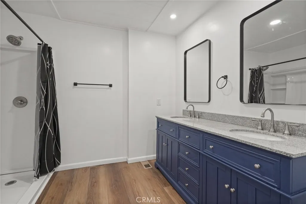 3033 E Valley, Unit 89 West Covina, CA 91792 - Photo 28 of 55 a bathroom with a granite countertop sink toilet and shower