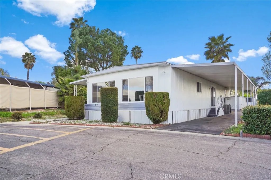 3033 E Valley, Unit 89 West Covina, CA 91792 - Photo 3 of 55 a view of a house with a yard
