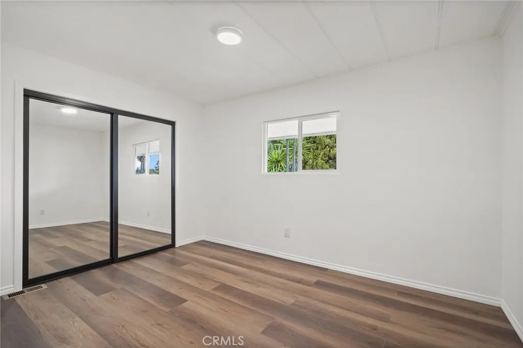 3033 E Valley, Unit 89 West Covina, CA 91792 - Photo 32 of 55 an empty room with windows and closet